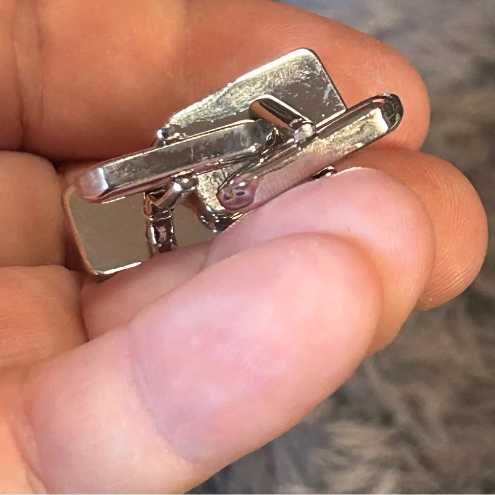 Modern gentleman’s cat eye glass bar tilt style cuff links